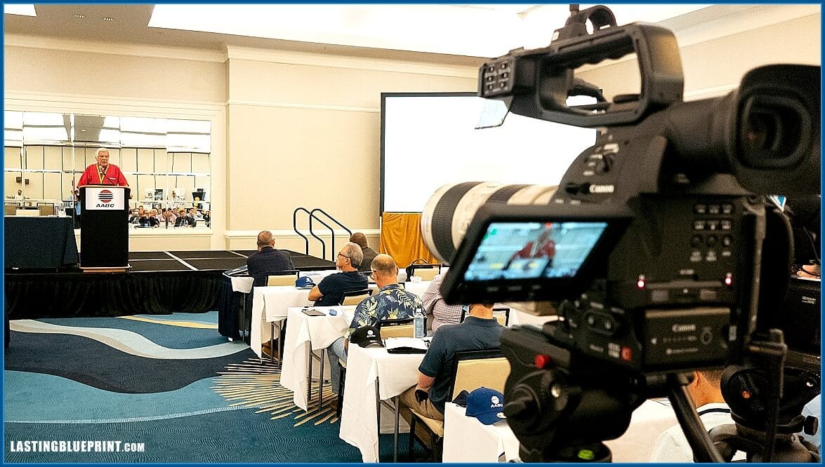 Annual Meeting Videographer recording speaker presentation.